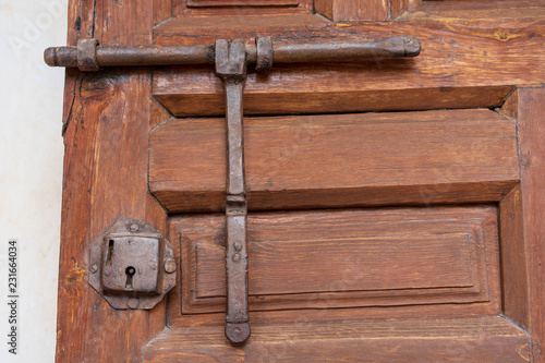old wooden door with iron lock
