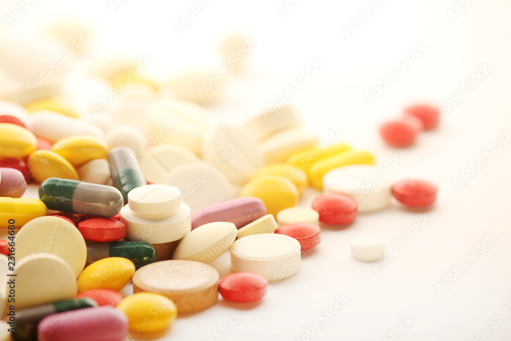 Different colorful tablets at white background Different colorful tablets at white background