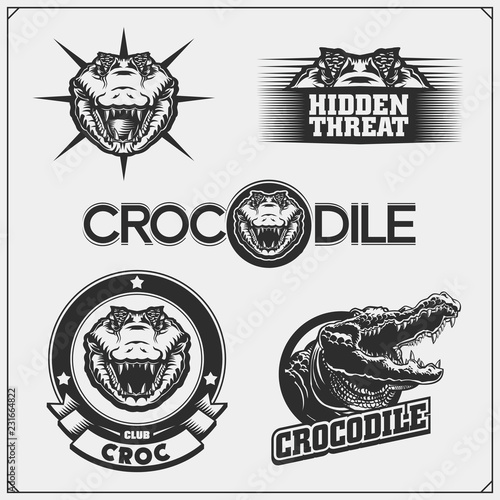 The emblems with crocodile for a sport team. Crocodile labels, badges and design elements.