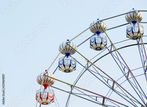 ferris wheel with the blue sky