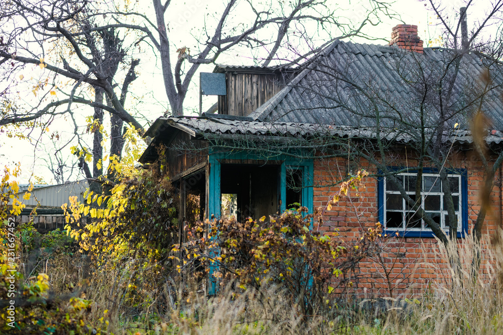 Old abandoned brick house among the autumn old garden Old abandoned brick house among the autumn old garden