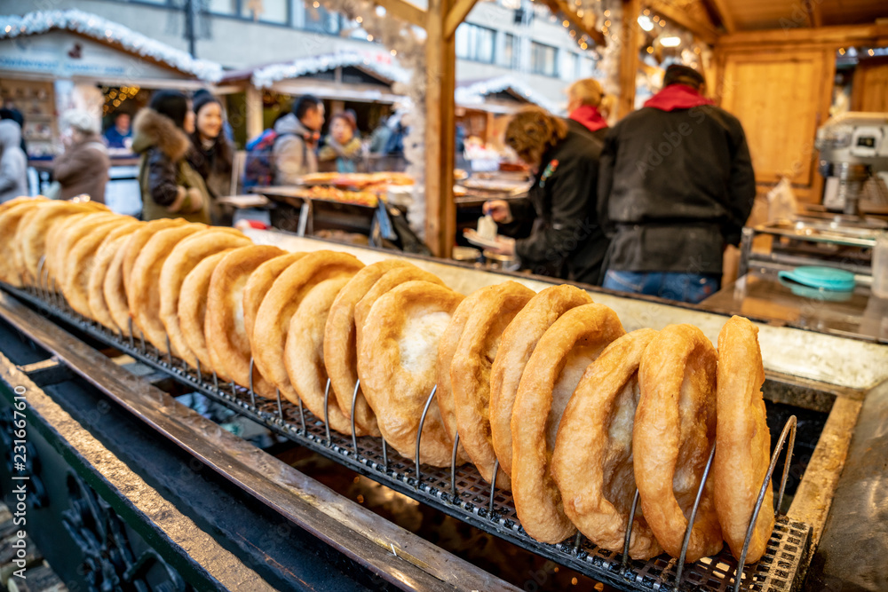 Fototapeta premium Budapest Christmas Market traditional street food called Langos doughnut