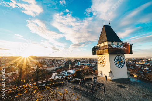 Graz clock tower and city symbol on top of Schlossberg hill at sunset