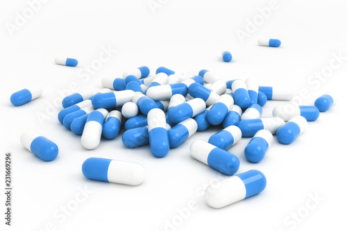 Group of blue capsules on white background bright light