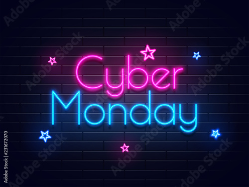 Neon text Cyber Monday on brick wall background with stars for advertisement concept.