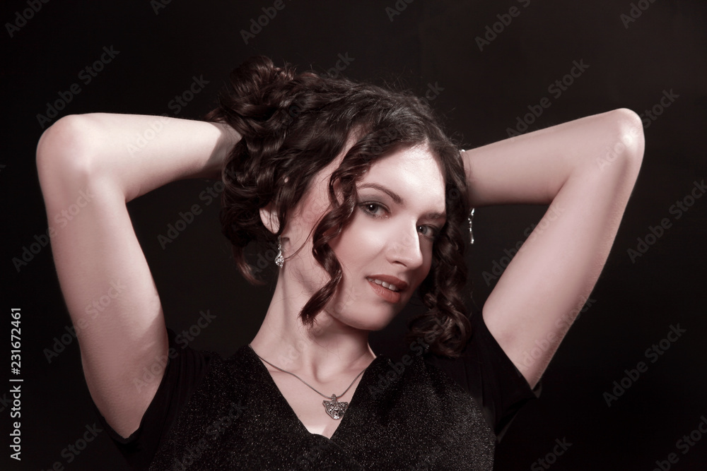 beautiful woman with evening make-up sitting in a chair. beautiful woman with evening make-up sitting in a chair.