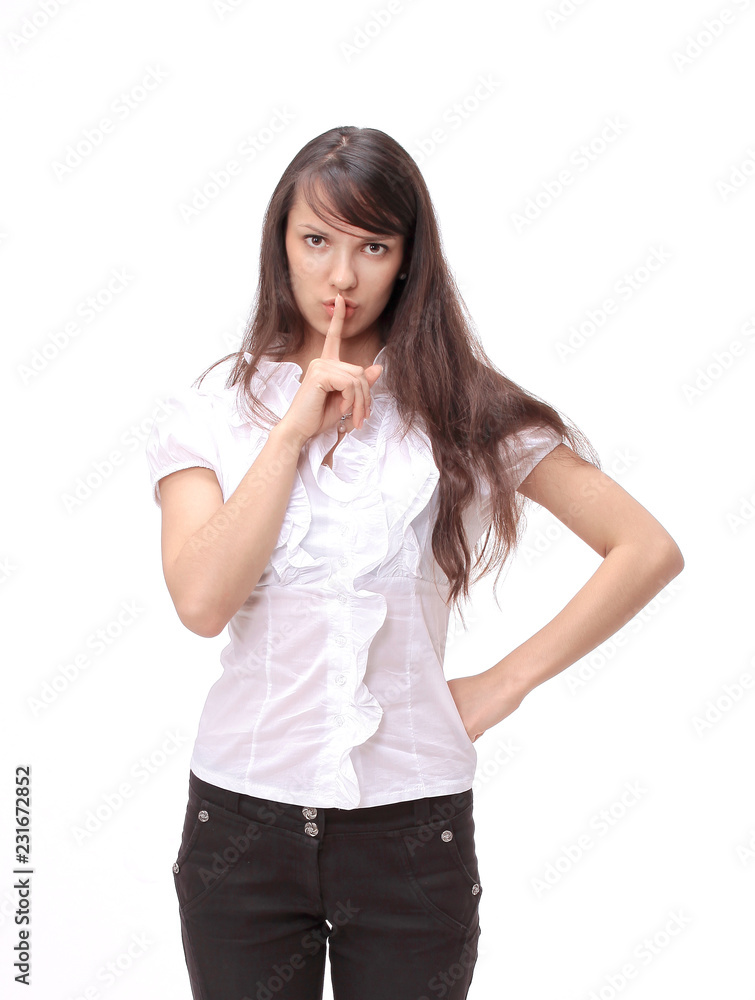 young serious business woman ,putting a finger to her lips young serious business woman ,putting a finger to her lips
