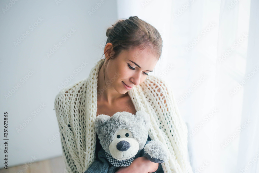 Young beautiful woman holding teddy bear plush for Valentine's Day Young beautiful woman holding teddy bear plush for Valentine's Day