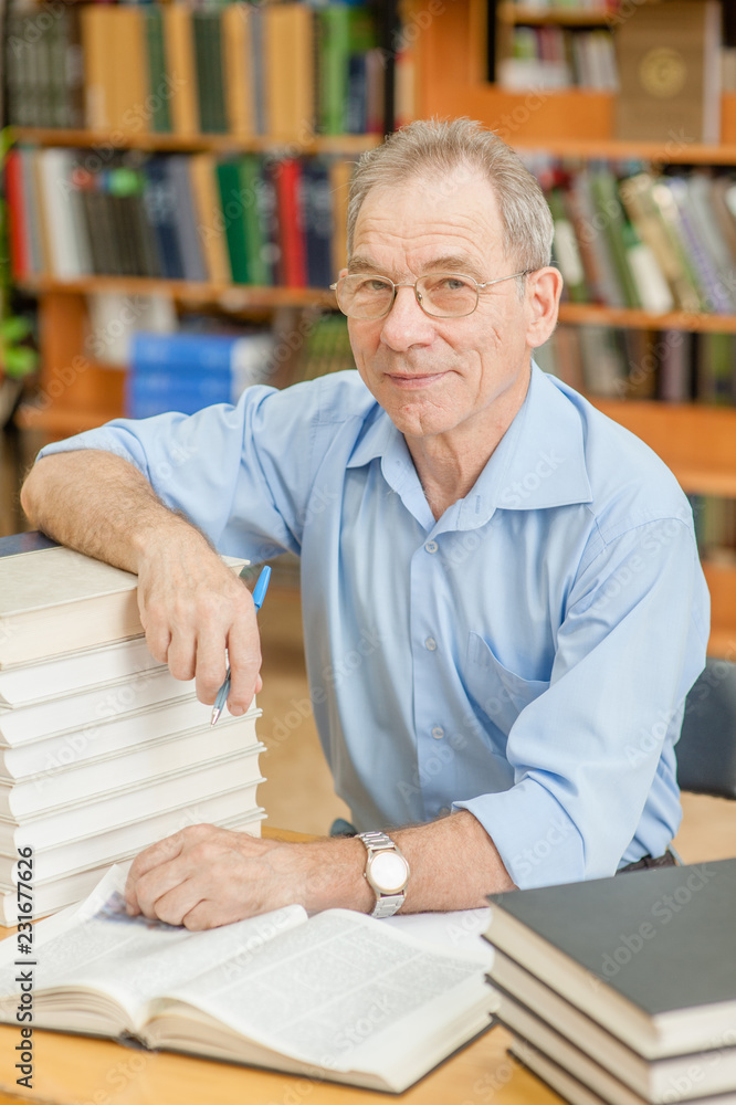portrait of an elderly man in the library portrait of an elderly man in the library