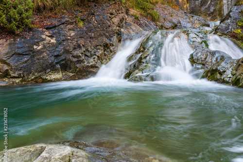 Waterfall and autumn colors. Magic of the Julian pre-Alps.