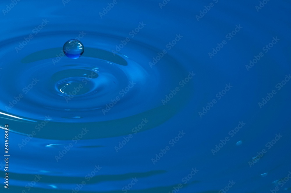Splash of colorful liquid with high speed flash Splash of colorful liquid with high speed flash