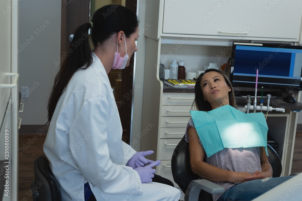 Female dentist interacting with patient Female dentist interacting with patient