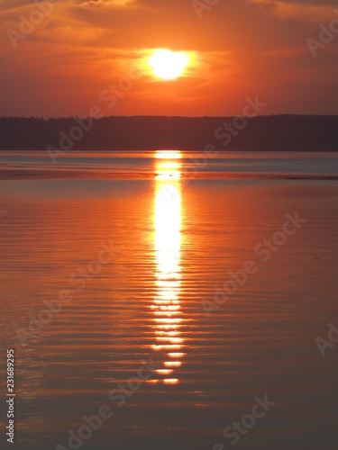 Sunset. On the big river. Coast. Summer. Russia, Ural, Perm region