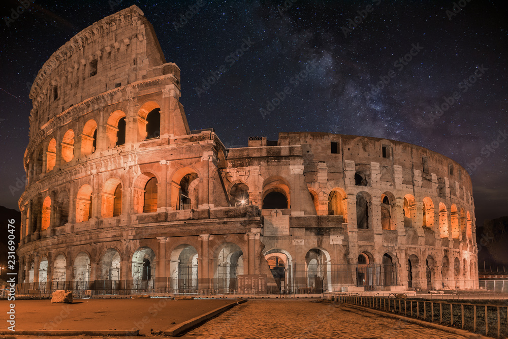 Coliseum in Rome by Night with milky way-  Colosseum is one of the main travel attractions - The Main symbol of Rome