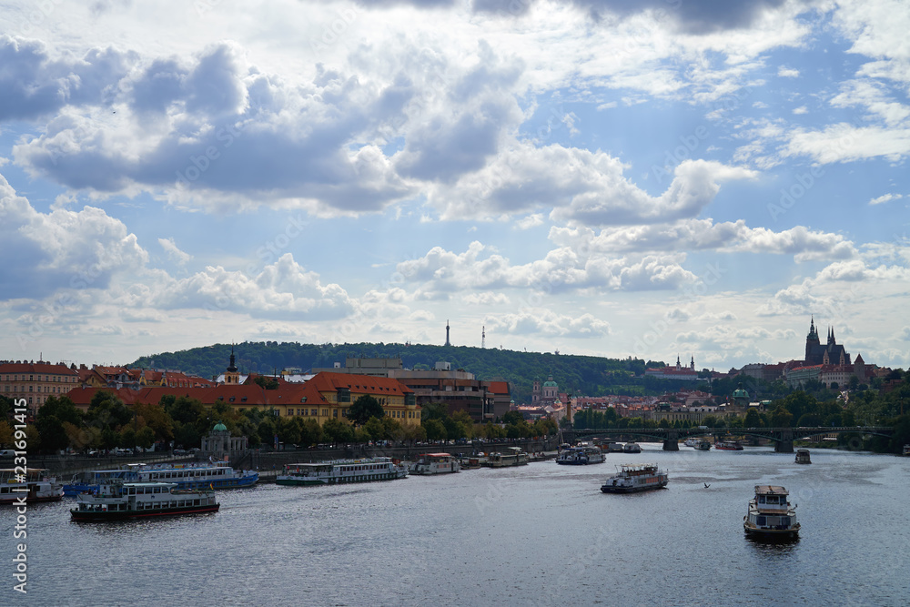 Famous Vltava river water canal with ships, skyline capital of Czech republic medievil architecture historical landmark