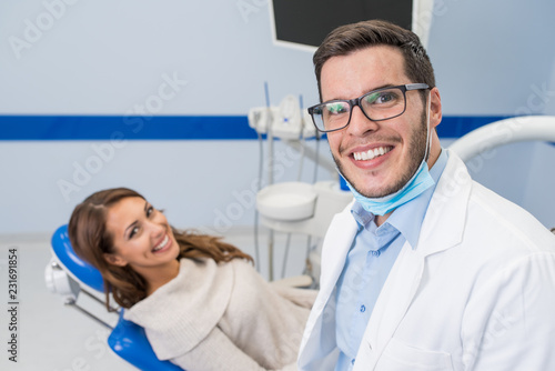 Satisfited patient with her dentist