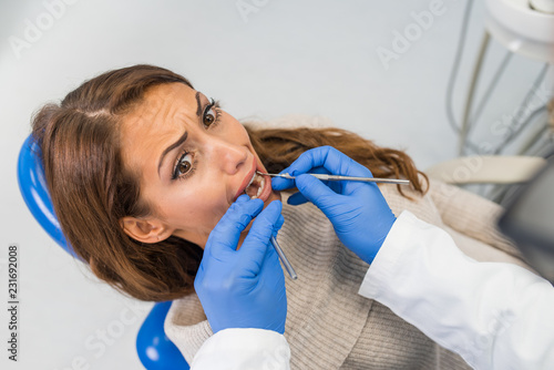 Professional dentist examining teeth