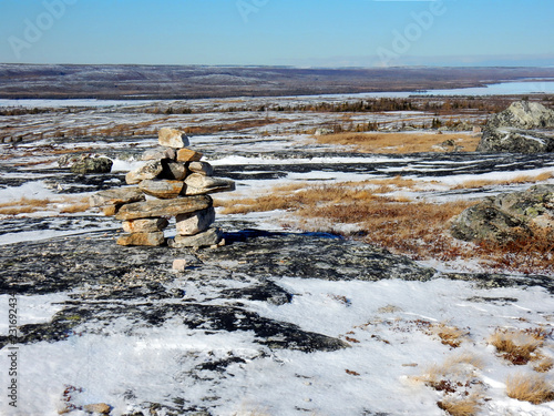 Inuksuk statue on the top of a mountain where the radar is in Kuujjuaq