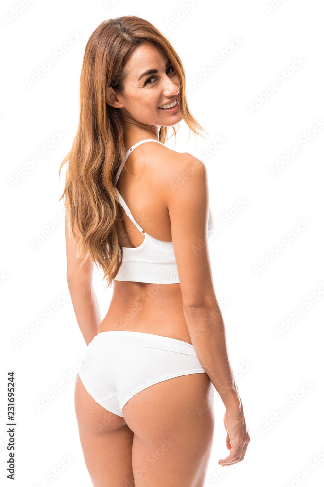 Obraz premium Rear view of a Beautiful Woman Smiling In White Lingerie