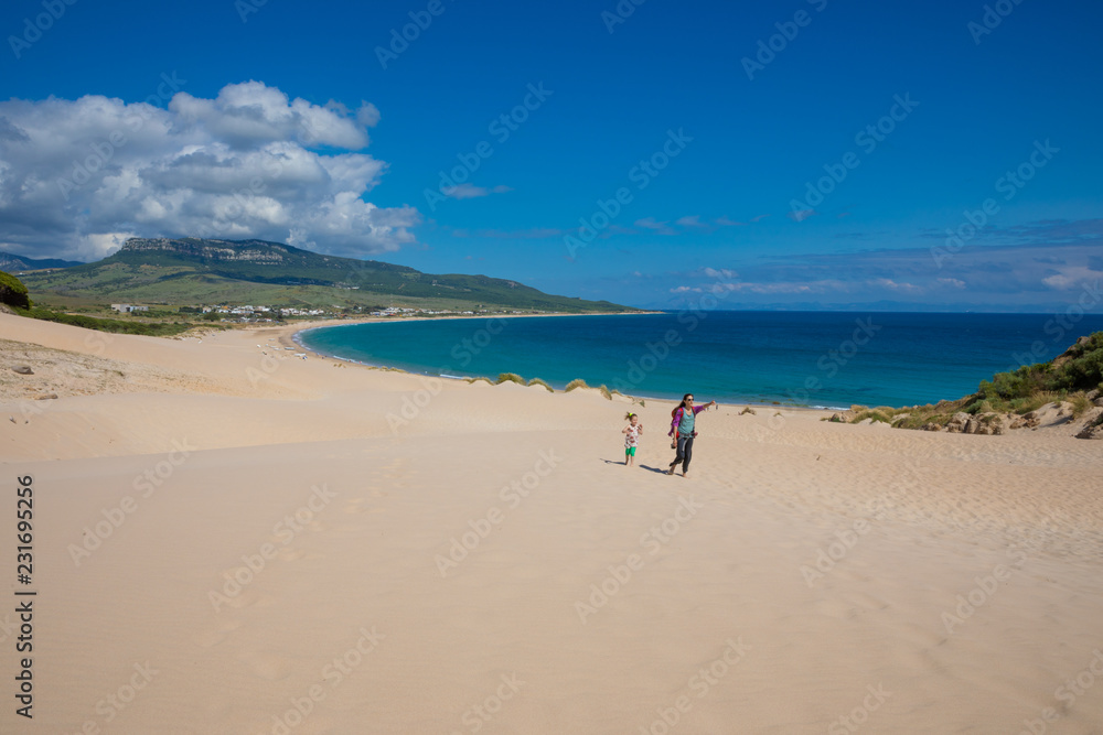 beautiful landscape of Bolonia Beach with woman and girl walking