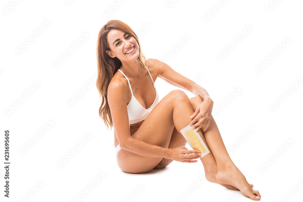 Obraz premium Woman Maintaining Hygiene With Waxing Strips