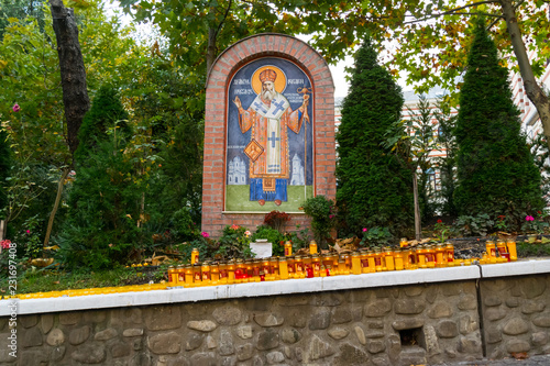 Bucharest, Romania - November 04, 2018: Candles lit at Radu Voda Monastery dedicated to Saint Nectarios of Aegina and The Holy Trinity situated in Bucharest, Romania.