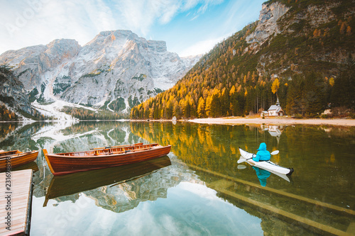 Obraz na płótnie Young man in kayak at Lago di Braies in fall, Dolomites, Italy w salonie