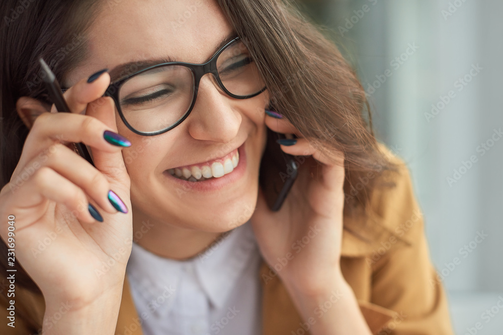 Portrait of young middle eastern woman talking on the phone Portrait of young middle eastern woman talking on the phone