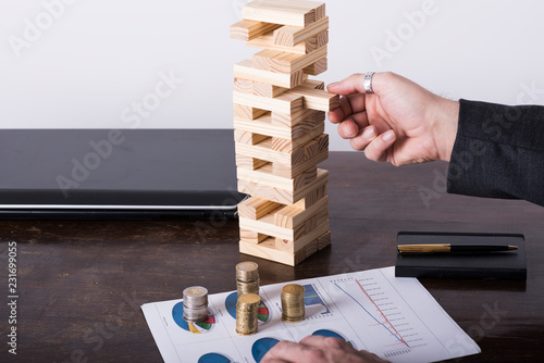 Image expressing a business and finance concept with tower game