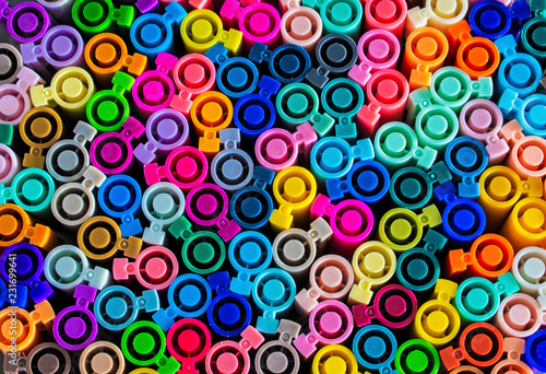 Set of several colored markers of different colors, the top view of the covers.