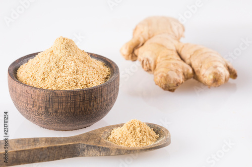 Fresh ginger root and ground ginger spice - Zingiber officinale. White background