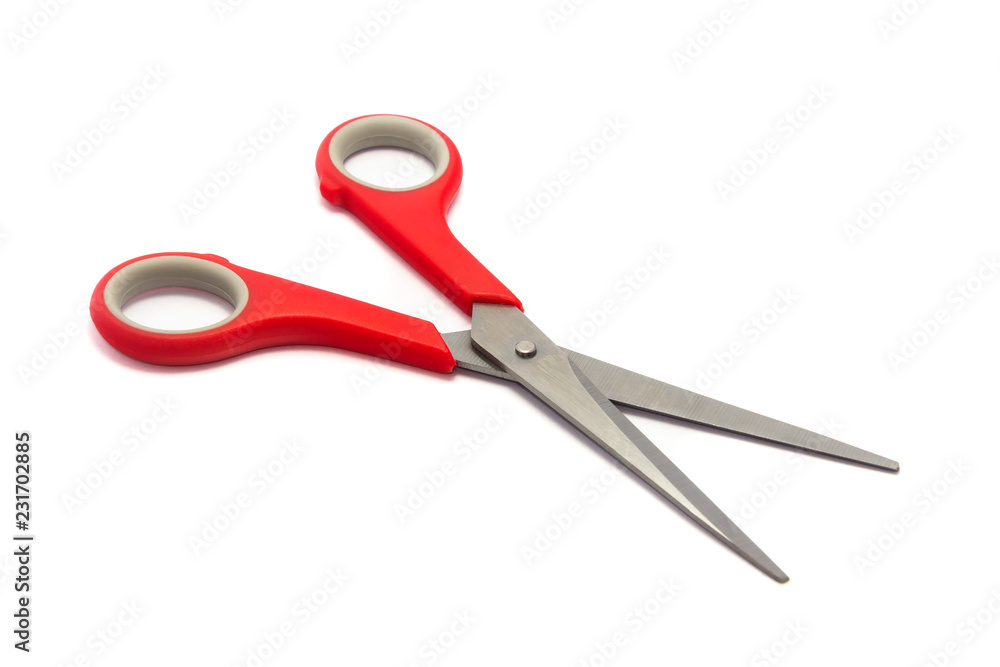 Scissor with red plastic handles isolated on white background. Scissor with red plastic handles isolated on white background.