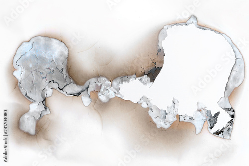 Photography Hole burnt in a sheet of paper - throughhole