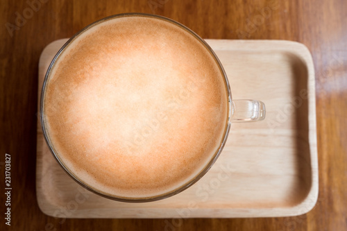 coffee latte on wood plate
