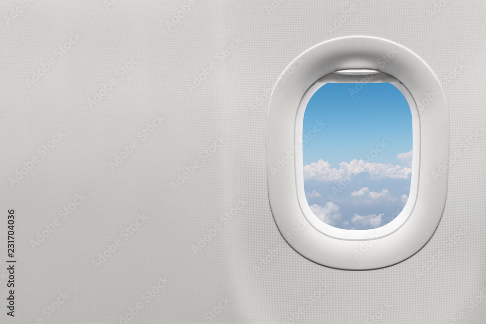Isolated airplane window with blue sky Isolated airplane window with blue sky