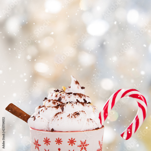 Christmas cup with hot chocolate and whipped cream.