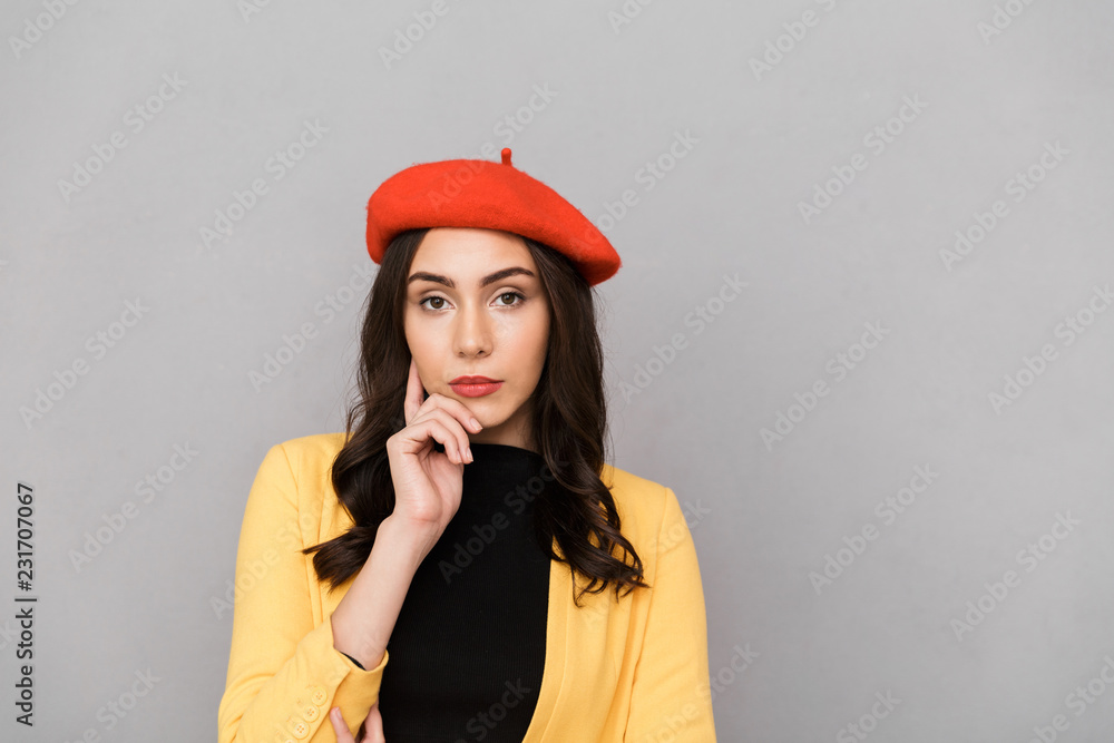Close up of a pensive young woman in red hat Close up of a pensive young woman in red hat