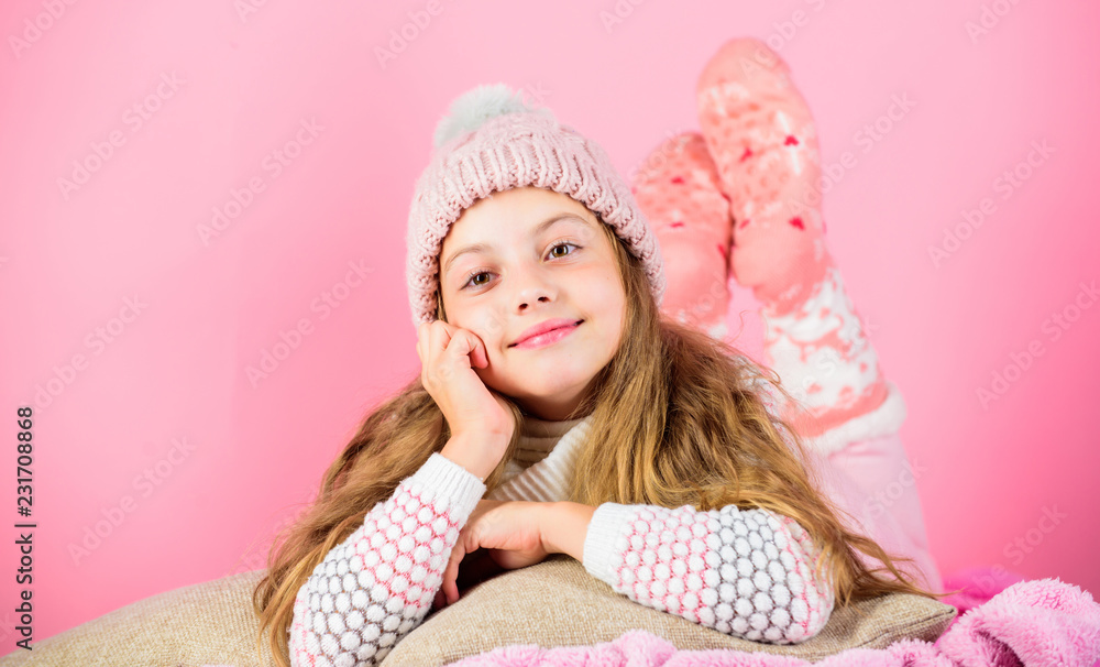 Winter fashion accessory. Kid girl knitted hat and scarf. Winter accessory concept. Girl long hair dream pink background. Kid dreamy wear knitted hat. Winter rest and relax. Winter season concept Winter fashion accessory. Kid girl knitted hat and scarf. Winter accessory concept. Girl long hair dream pink background. Kid dreamy wear knitted hat. Winter rest and relax. Winter season concept