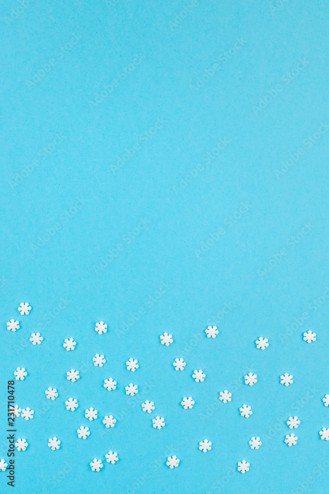 Winter pattern made of small white snowflakes Winter pattern made of small white snowflakes