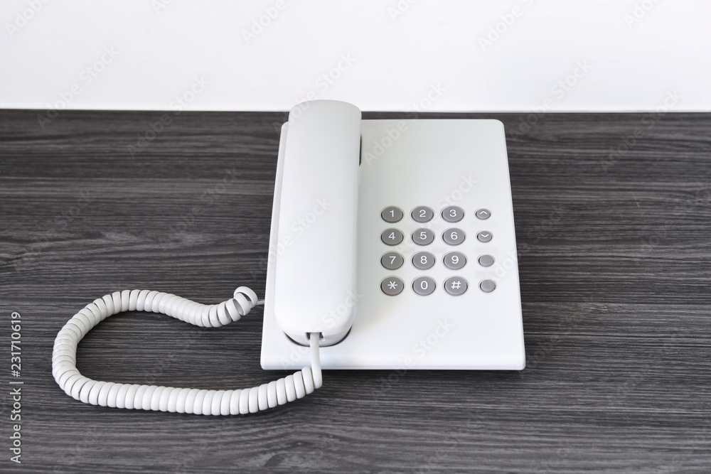 White telephone cable on desk, office concept White telephone cable on desk, office concept