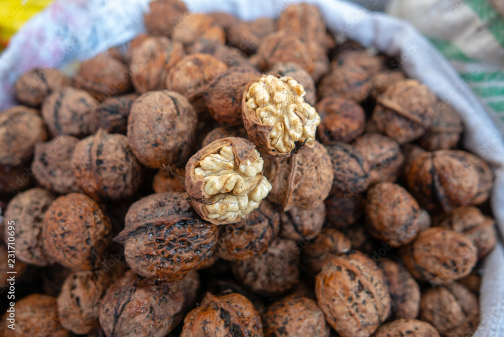 Fresh walnuts being sold at Shangri La wet market in Deqen, Yunnan, China. Fresh walnuts being sold at Shangri La wet market in Deqen, Yunnan, China.