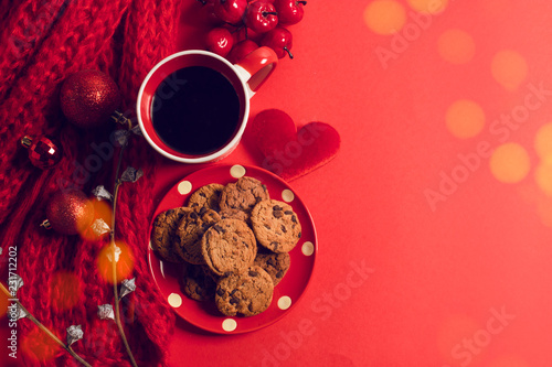 vintage red color cookies dessert sweet and coffee with bokeh light and decoration for season greeting of merry christmas concept