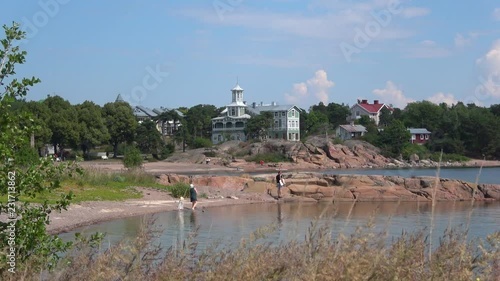 Walking along the shore, summer in Hanko. Southern Finland photo