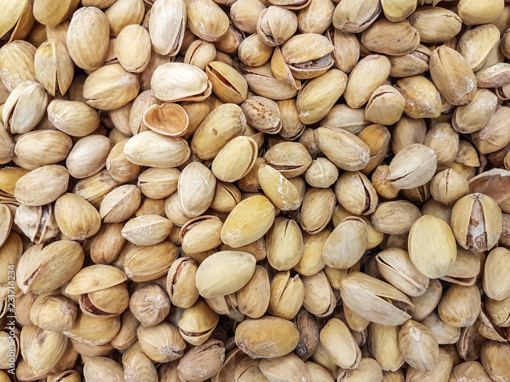 Fototapeta premium Roasted pistachios as a backgrounds or textures in close-up