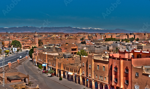 View over Ouarzazate with the snowed Great Atlas in the distance photo