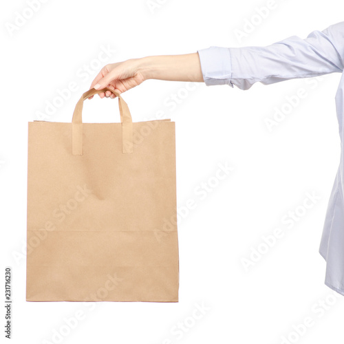Woman holding a paper bag shopping beauty on a white background. Isolation