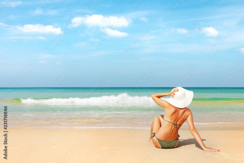 Fototapeta premium Young attractive woman on the beach