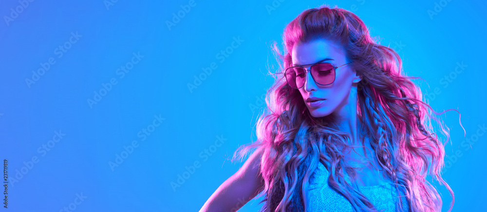 High Fashion. Party disco girl with pink neon hairstyle dance. Sensual  woman in Colorful uv Light. Vibrant fashionable creative Style. Night Club  music vibes, dancing. gel filter light, neon portrait Stock Photo |