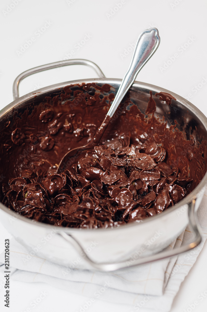 Chocolate covered cornflake cluster cookies, an easy and fun holiday or Christmas cooking project with kids, no-bake recipe for tiny cakes or semi-sweet cocoa snacks Chocolate covered cornflake cluster cookies, an easy and fun holiday or Christmas cooking project with kids, no-bake recipe for tiny cakes or semi-sweet cocoa snacks