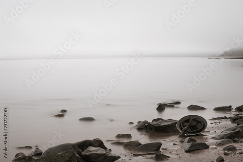 Fotografie World War era Brodie helmet on beach.